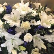 ice blue casket spray